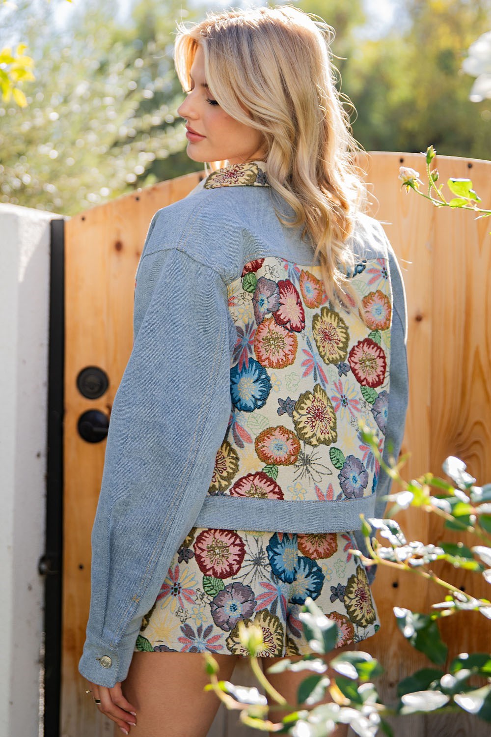 RARA Boutique vintage floral tapestry denim jacket with colorful floral embroidery and classic denim design.