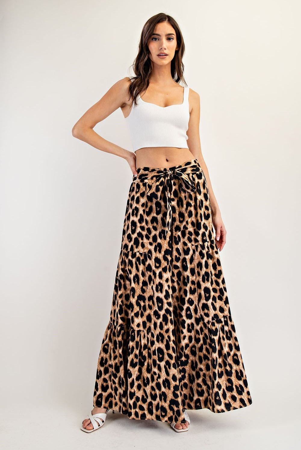 Leopard print tiered wide-leg palazzo pants with waist tie from RARA Boutique, shown on a model. Stylish and comfortable fashion.