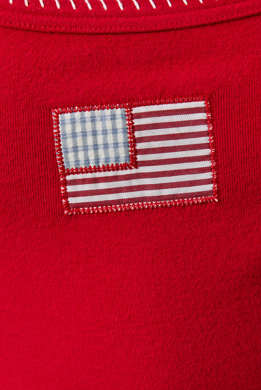 Red patchwork American flag cropped tank top with contrast trim by RARA Boutique, featuring a stylish sleeveless design.