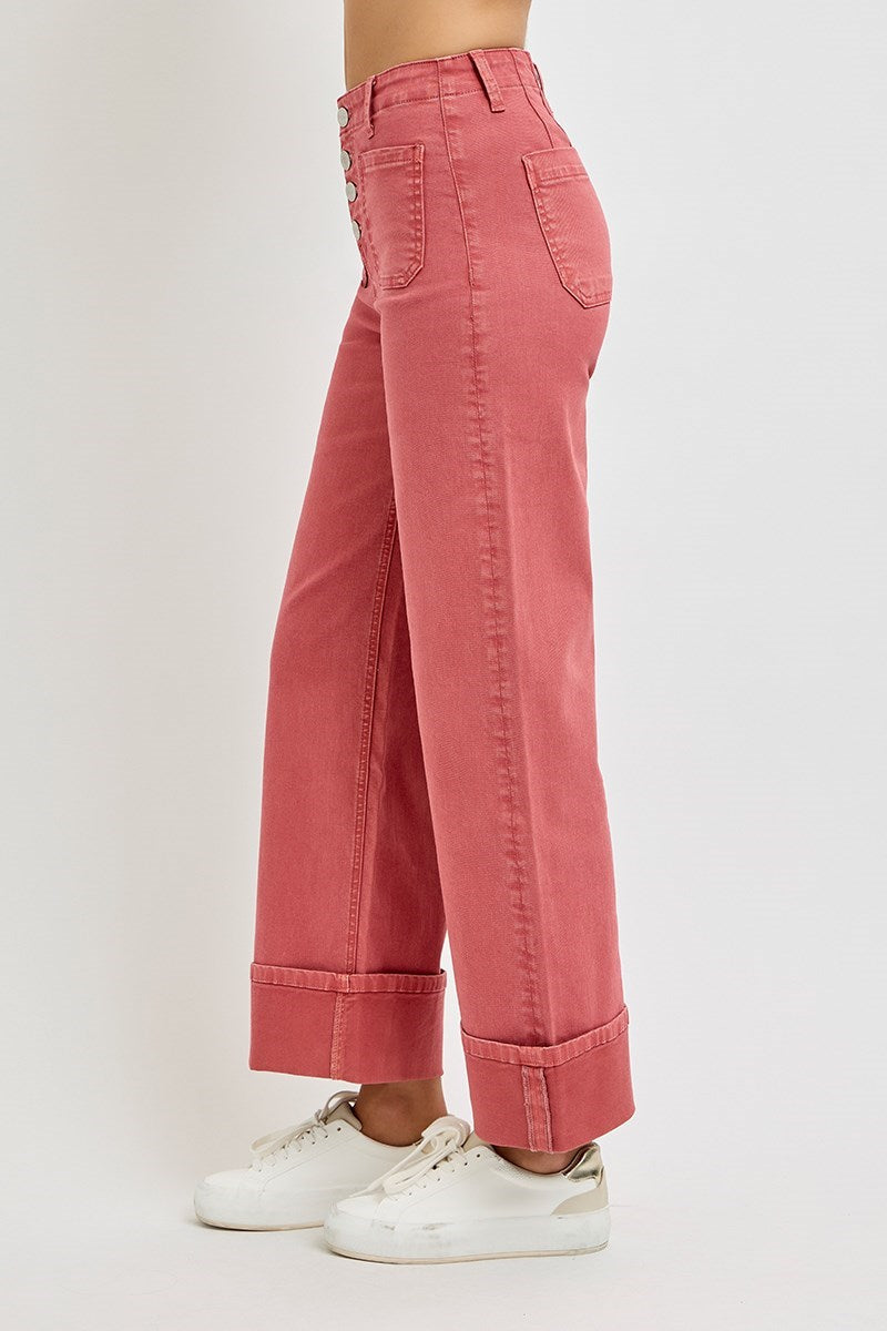 Risen wide leg patch pocket button fly jeans in brick color, showcasing relaxed fit and classic denim style.