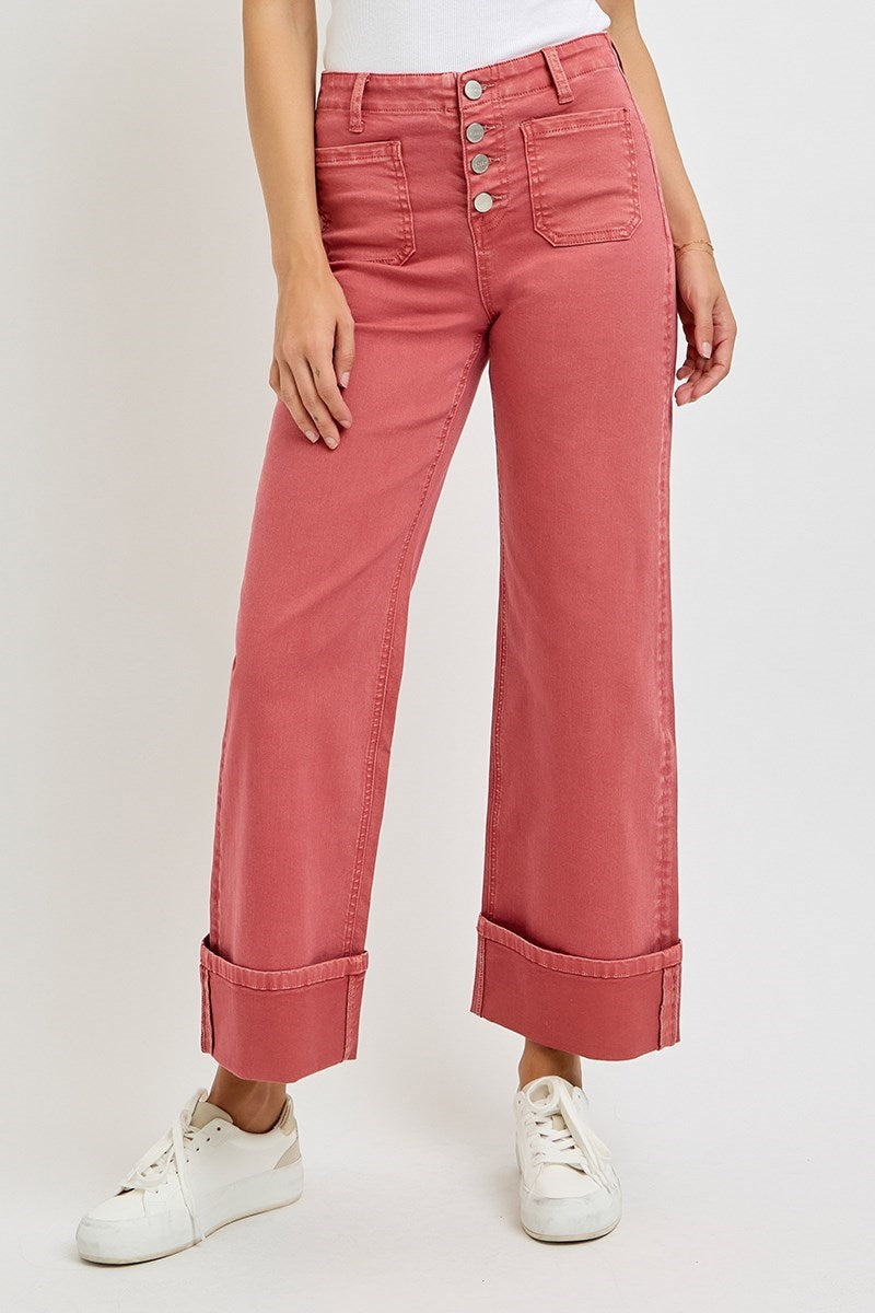 Risen wide leg patch pocket button fly jeans in brick color, featuring relaxed fit, front and back pockets, and classic denim style.