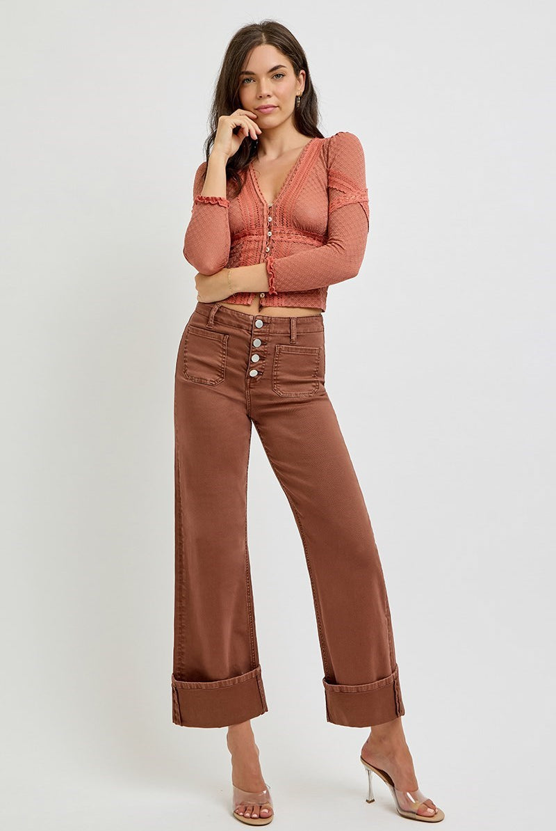 Risen wide leg patch pocket button fly jeans in espresso color, with relaxed fit and classic denim style.