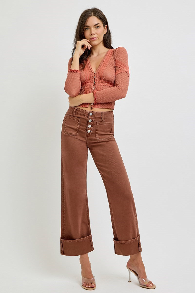 Risen wide leg patch pocket button fly jeans in espresso color, with relaxed fit and classic denim style.