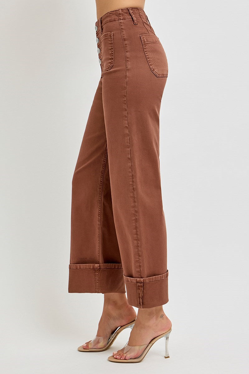 Risen wide leg patch pocket button fly jeans in espresso color, featuring classic denim style and relaxed fit.