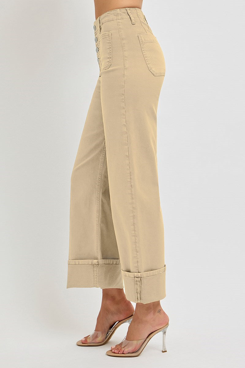 Risen wide leg patch pocket button fly jeans in a latte color, featuring relaxed fit and classic denim style.