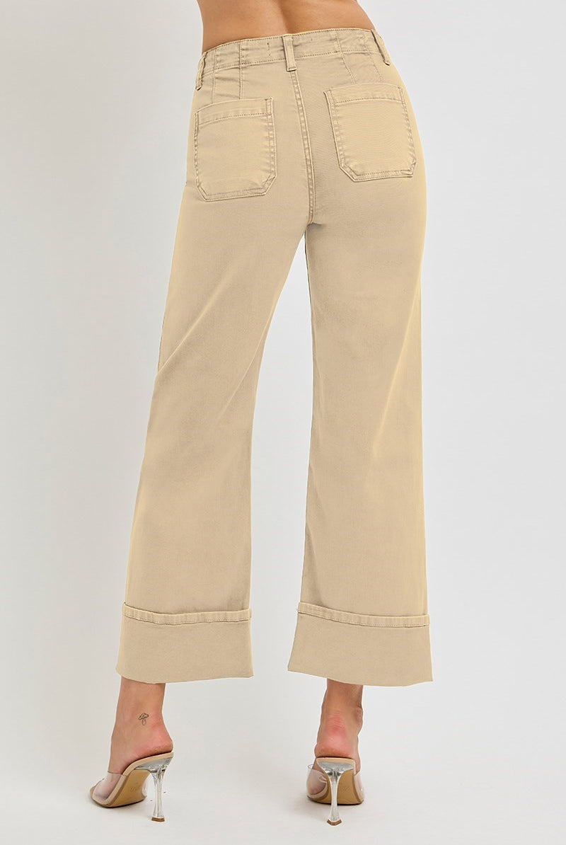 Light brown wide leg Risen jeans with patch pockets and button fly, styled with a relaxed fit and casual denim look.