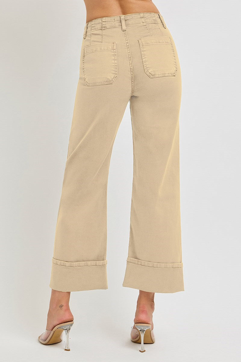 Light brown wide leg Risen jeans with patch pockets and button fly, styled with a relaxed fit and casual denim look.