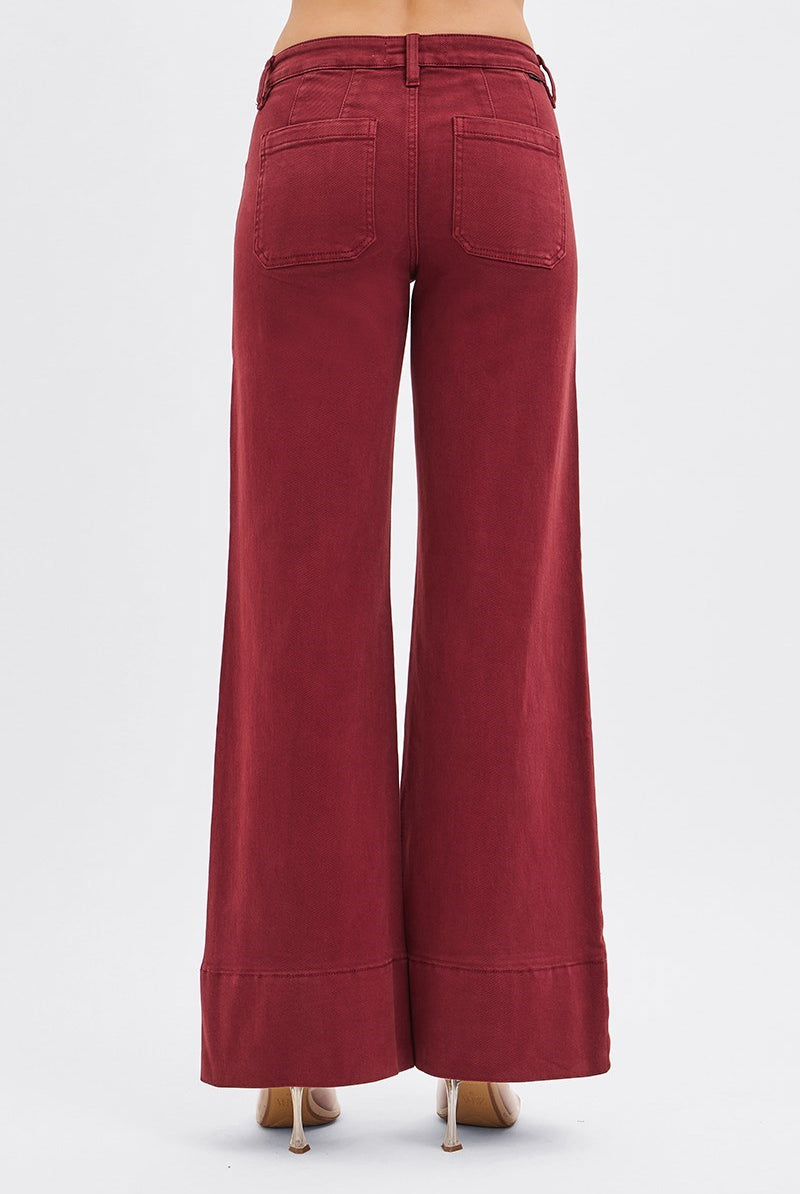RARA Boutique wine-colored tummy control mid-rise pin tuck wide leg jeans with wide hem, showing front view with belt loops and pockets.