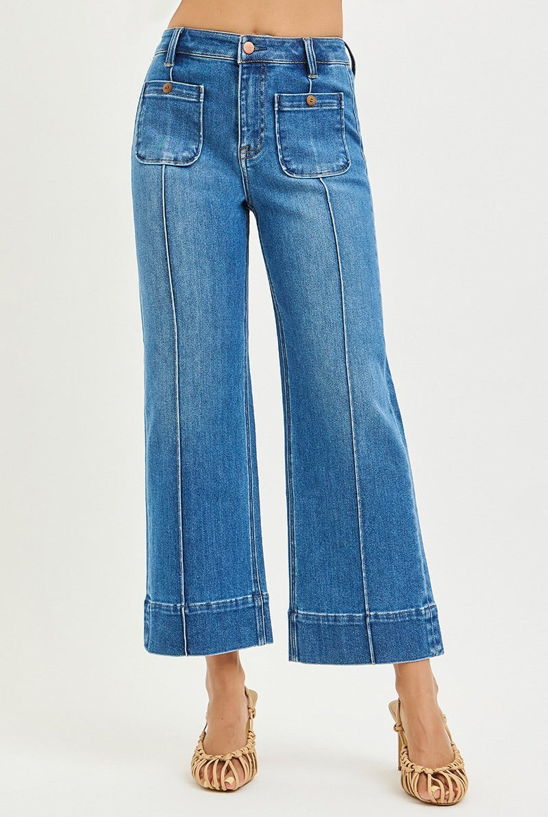 Medium wash Risen Pintuck Square Patch Pocket Wide Leg Cropped Jeans showing front view with patch pockets and wide-leg style.