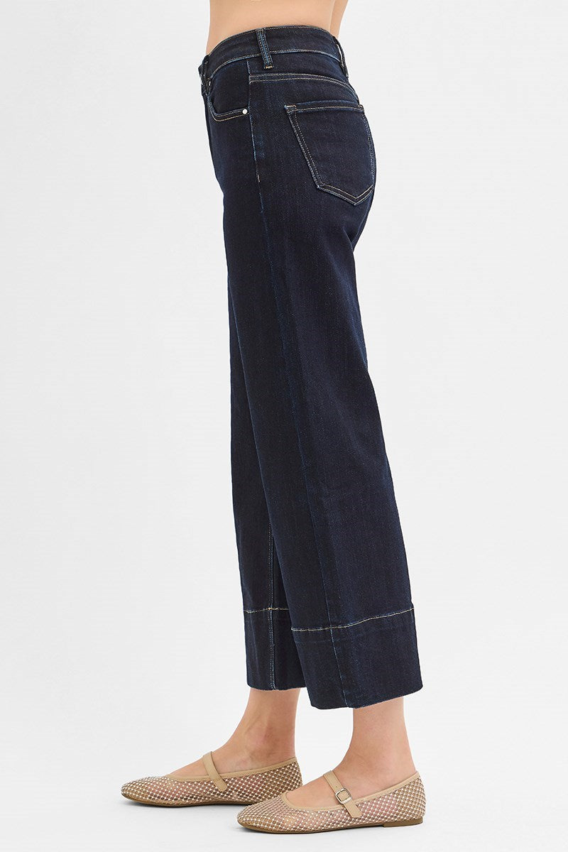 Dark wash Pintuck Tummy Control Wide Leg Cropped Jeans with wide hem by RARA Boutique, showcasing the relaxed fit and stylish design.