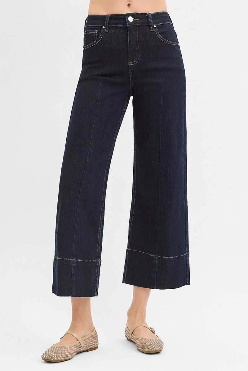 Dark rinse Pintuck Tummy Control Wide Leg Cropped Jeans with wide hem from Risen, showcasing a relaxed fit and stylish design.