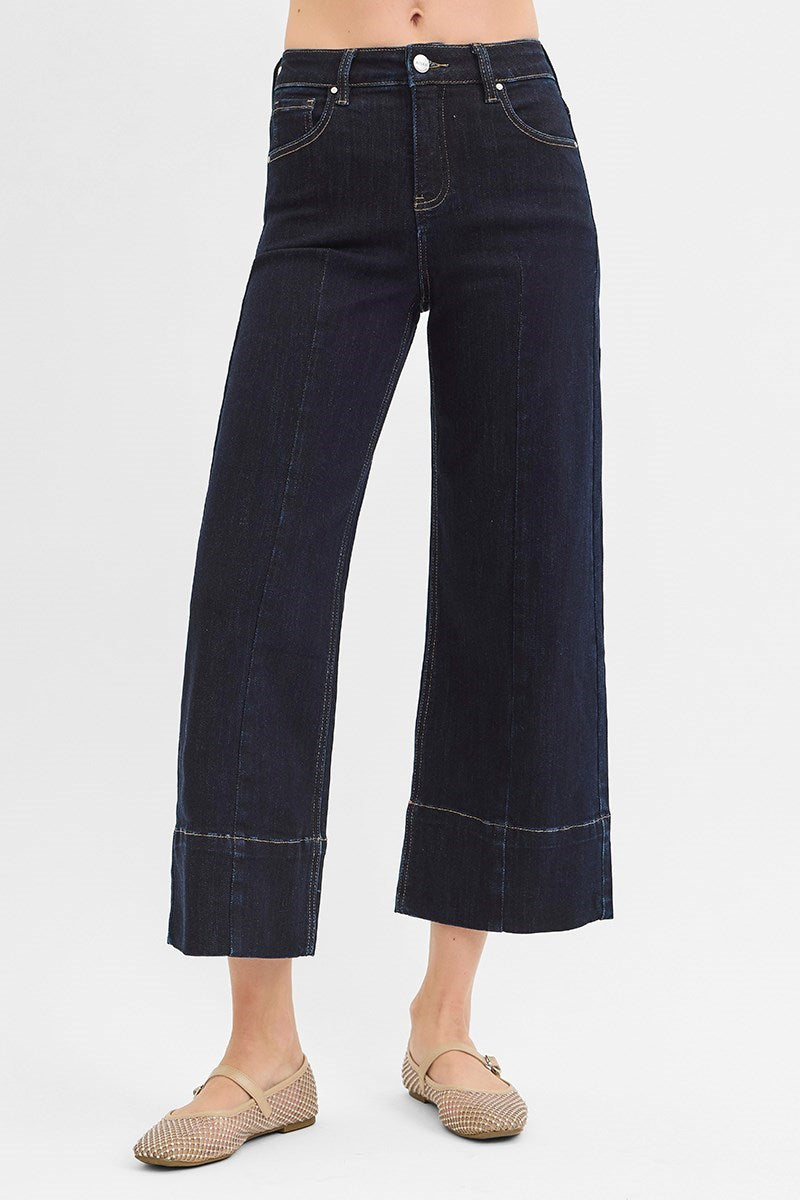 Dark rinse Pintuck Tummy Control Wide Leg Cropped Jeans with wide hem from Risen, showcasing a relaxed fit and stylish design.