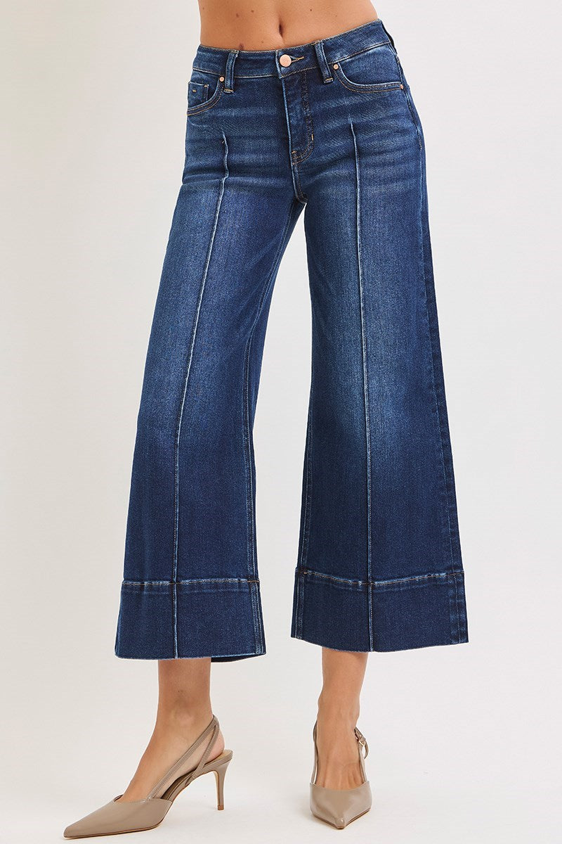 Deep blue pintuck tummy control wide leg cropped jeans with wide hem by RARA Boutique, showing front view with high waist and relaxed fit.