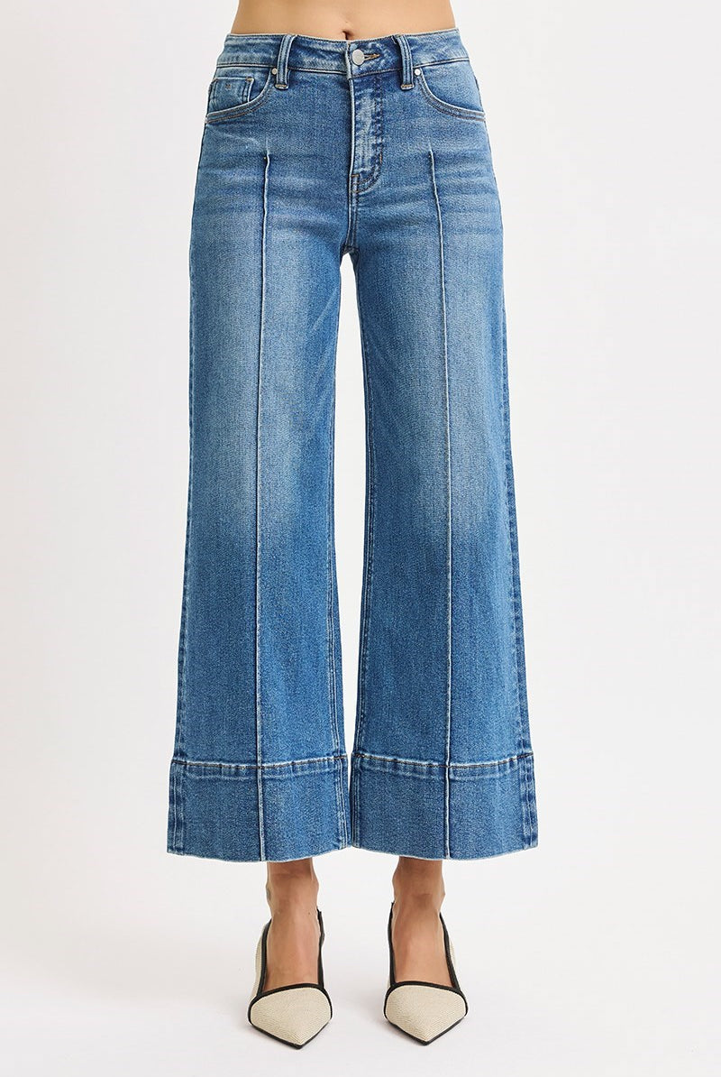 Medium wash Risen pintuck tummy control wide leg cropped jeans with wide hem, stylish and comfortable denim for casual wear.