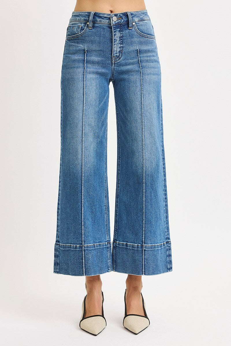 Medium wash Risen pintuck tummy control wide leg cropped jeans with wide hem, stylish and comfortable denim for casual wear.