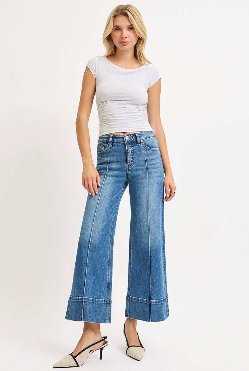 Medium shot of Risen Pintuck Tummy Control Wide Leg Cropped Jeans with wide hem, showcasing the relaxed fit and stylish design.