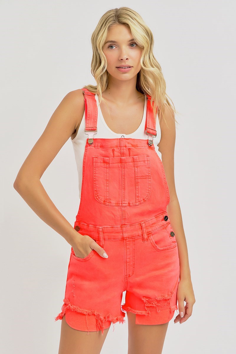 Distressed coral denim overalls by Risen, featuring adjustable straps, front pockets, and a casual, trendy fit.