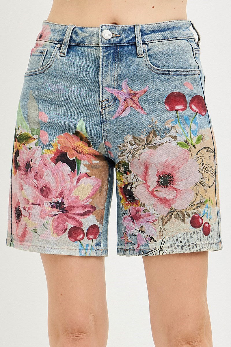 Artsy floral collage print wide-leg Bermuda denim shorts by Risen, featuring a colorful floral design and relaxed fit.