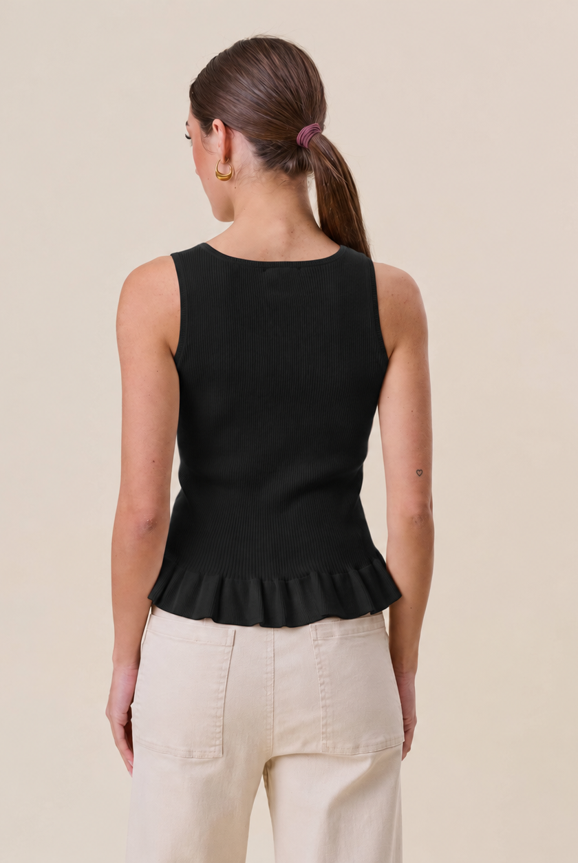 Able Tuesday Top AT3189 ruffle rib-knit tank top with layered ruffles and fitted ribbed fabric, shown on a white background.