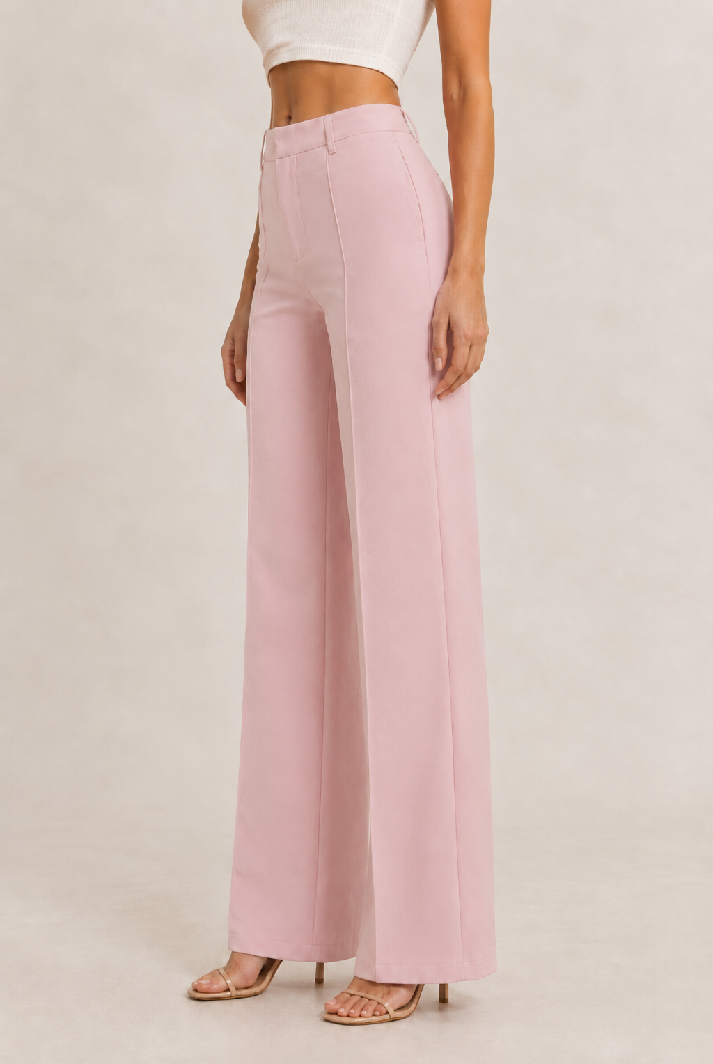 Light gray straight leg pintuck trouser pants by RARA Boutique displayed on a hanger, showcasing smooth fabric and tailored fit.