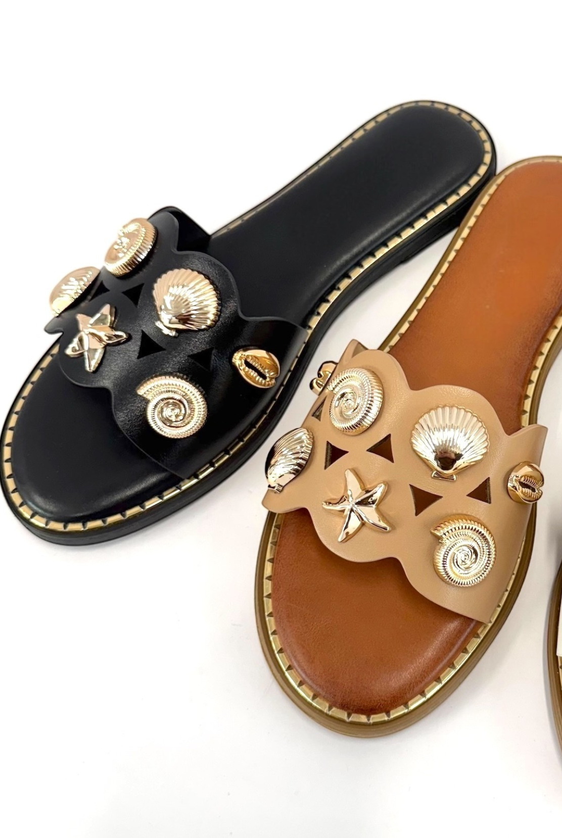 RARA Boutique seashell charm slide sandals featuring a casual sandal design with decorative seashell accents.