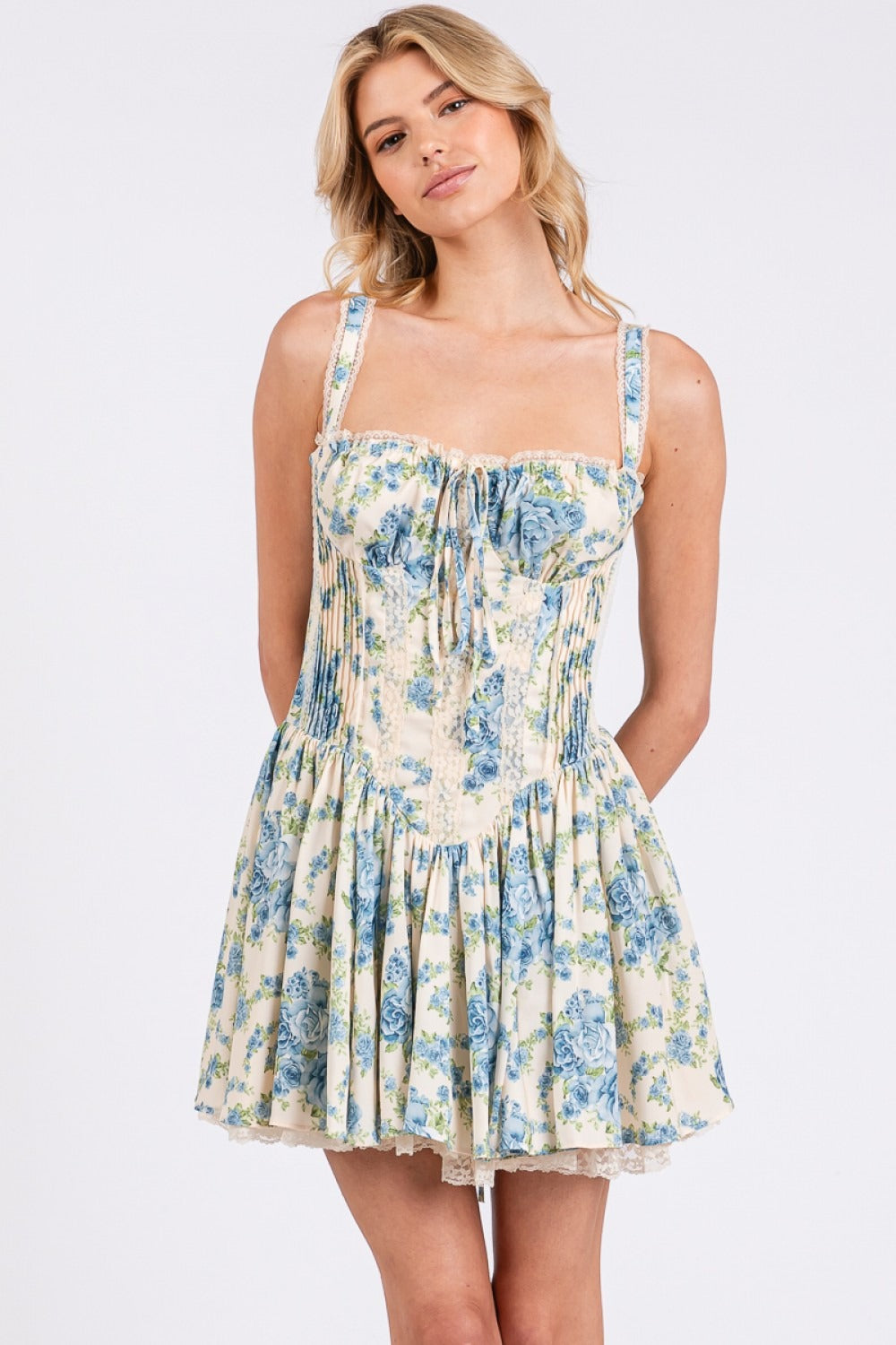 Floral corset drop-waist A-line mini dress from RARA Boutique, featuring a fitted bodice and flowy skirt with vibrant floral patterns.