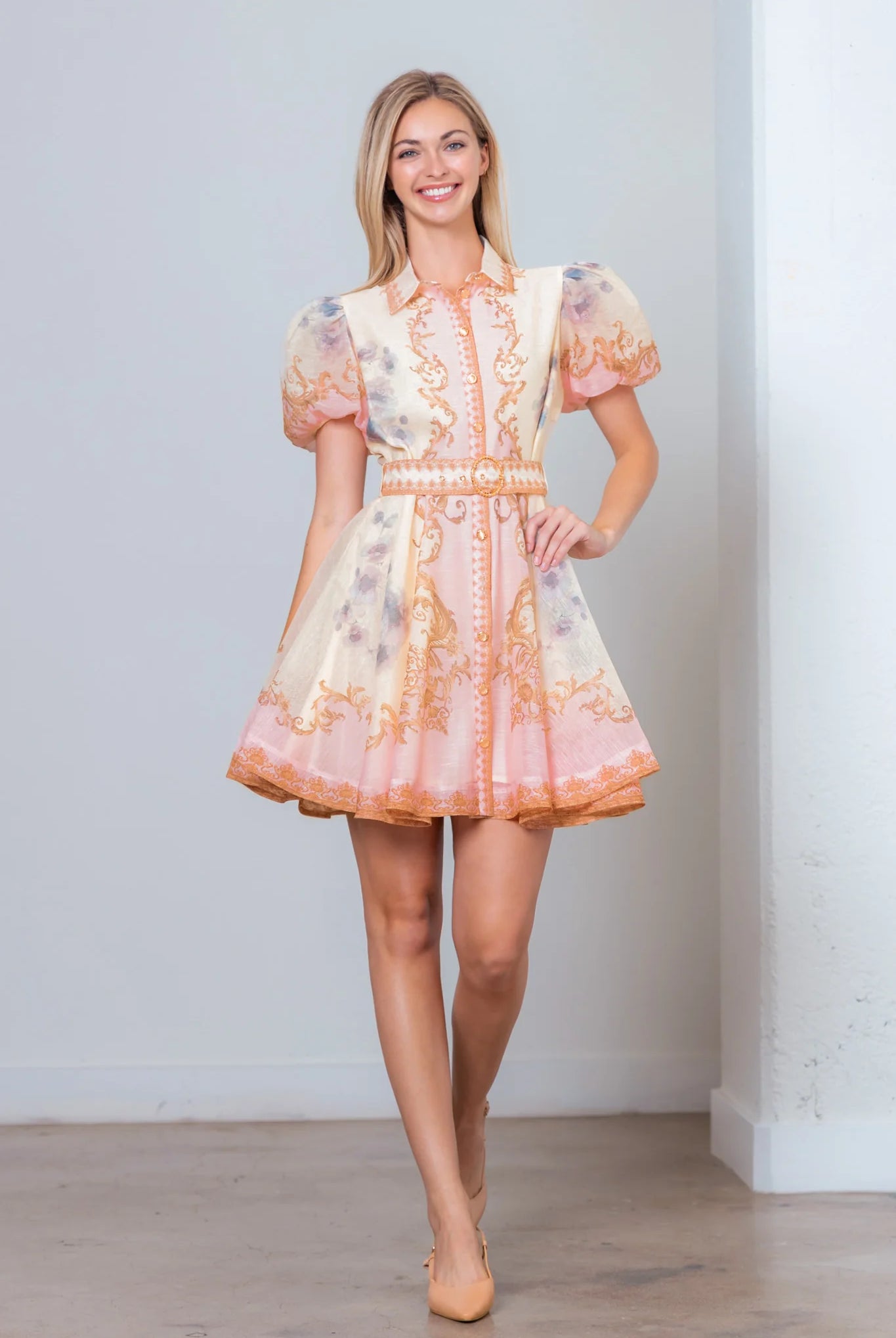 Pink Baroque scrollwork floral mini dress by RARA Boutique with pearl belt, showcasing elegant design and intricate pattern.