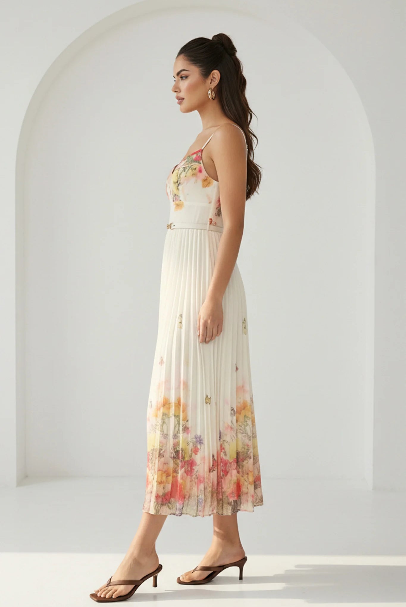 Watercolor floral butterfly pleated midi dress with belt in peach by RARA Boutique, featuring a flowy, feminine design.