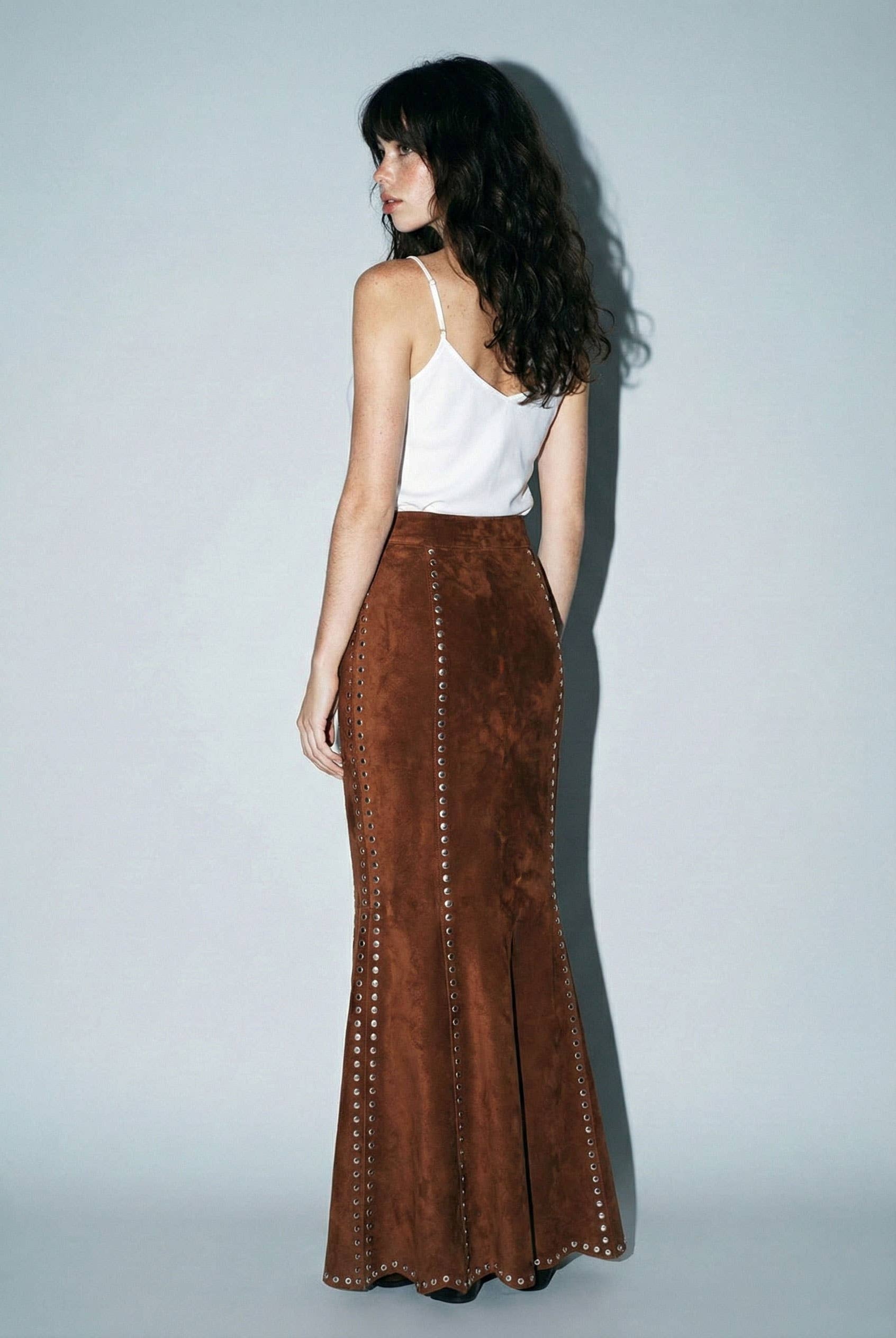 Skylar Rose suede studded maxi skirt shown in a stylish, flowing design with metal stud embellishments