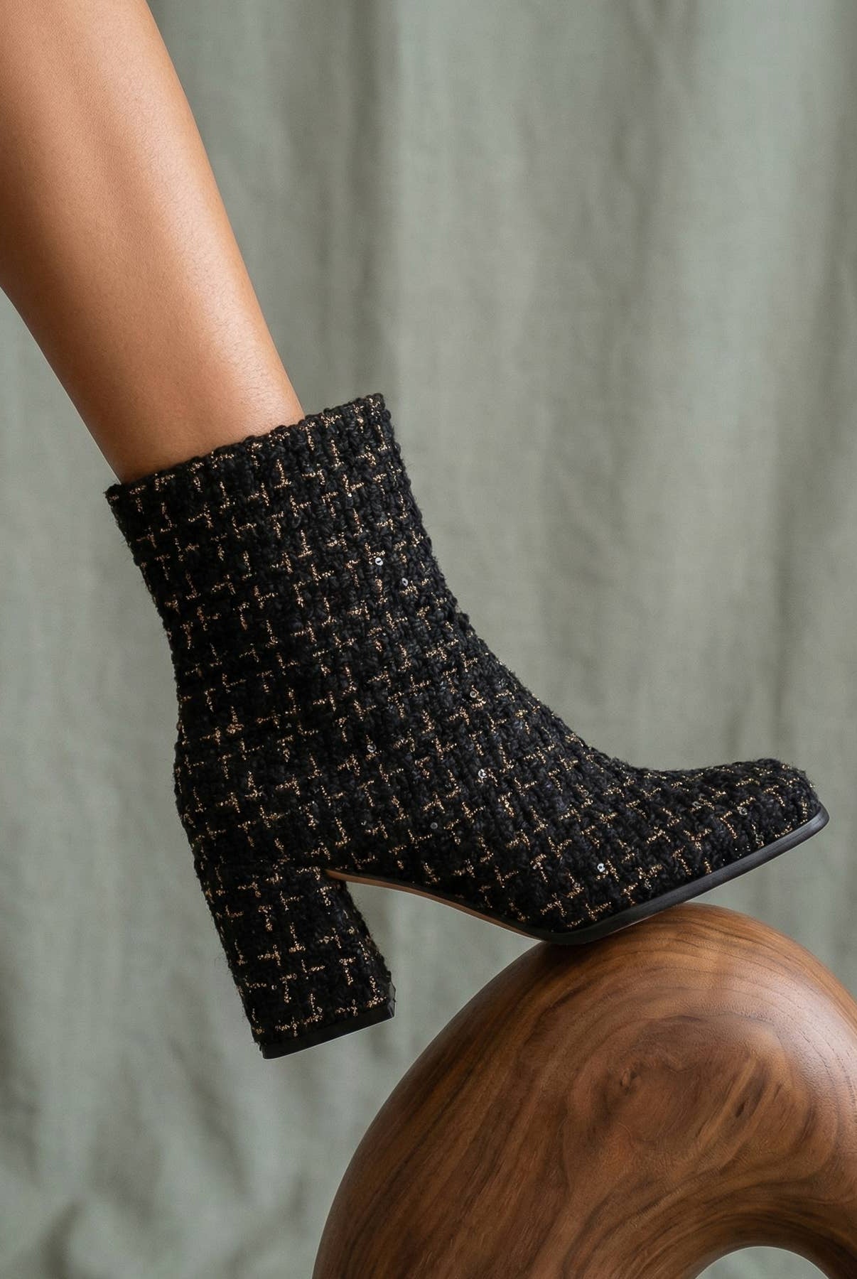 Black tweed woven block heel ankle fall boot from Oasis Society featuring a stylish design and sturdy heel.