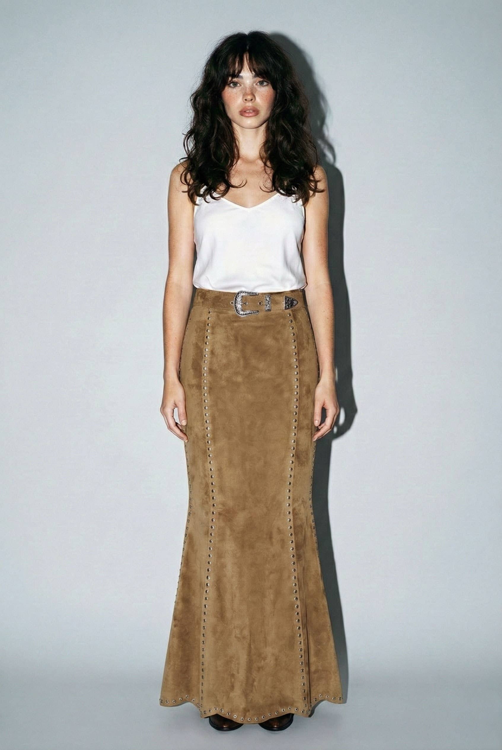 Skylar Rose suede studded maxi skirt in tan with silver stud details, flowing design, and high waist.
