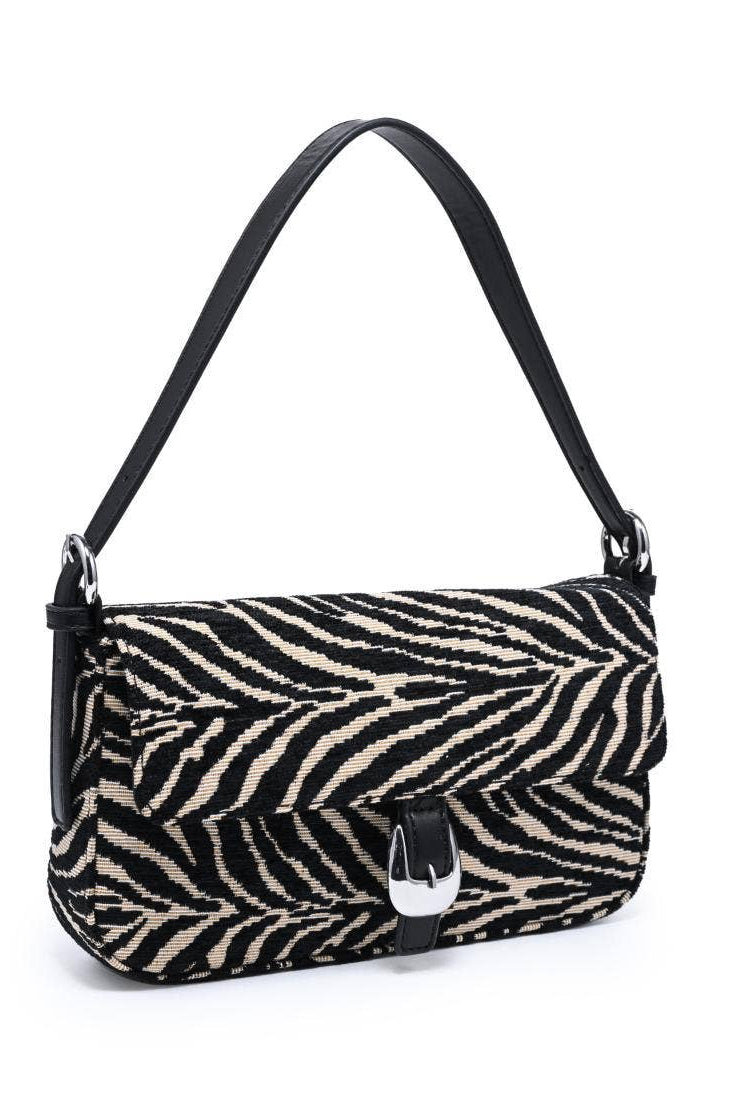 Urban Expressions Tuesday Gloria zebra shoulder bag with black and white striped pattern and adjustable shoulder strap.