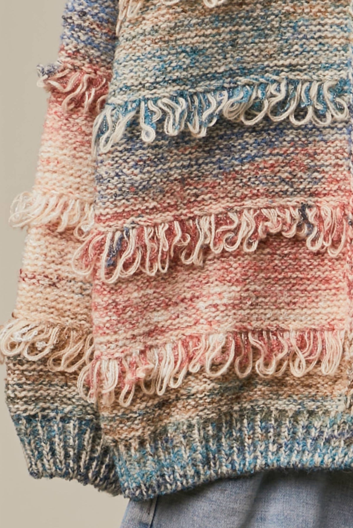 Multicolor textured fringe button-down cardigan sweater by RARA Boutique featuring vibrant colors and cozy knit fabric.