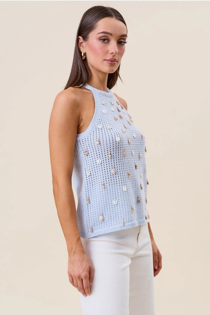 RARA Boutique seashell-embellished open-knit halter tank top with a stylish, breezy design, featuring seashell accents and open back style.