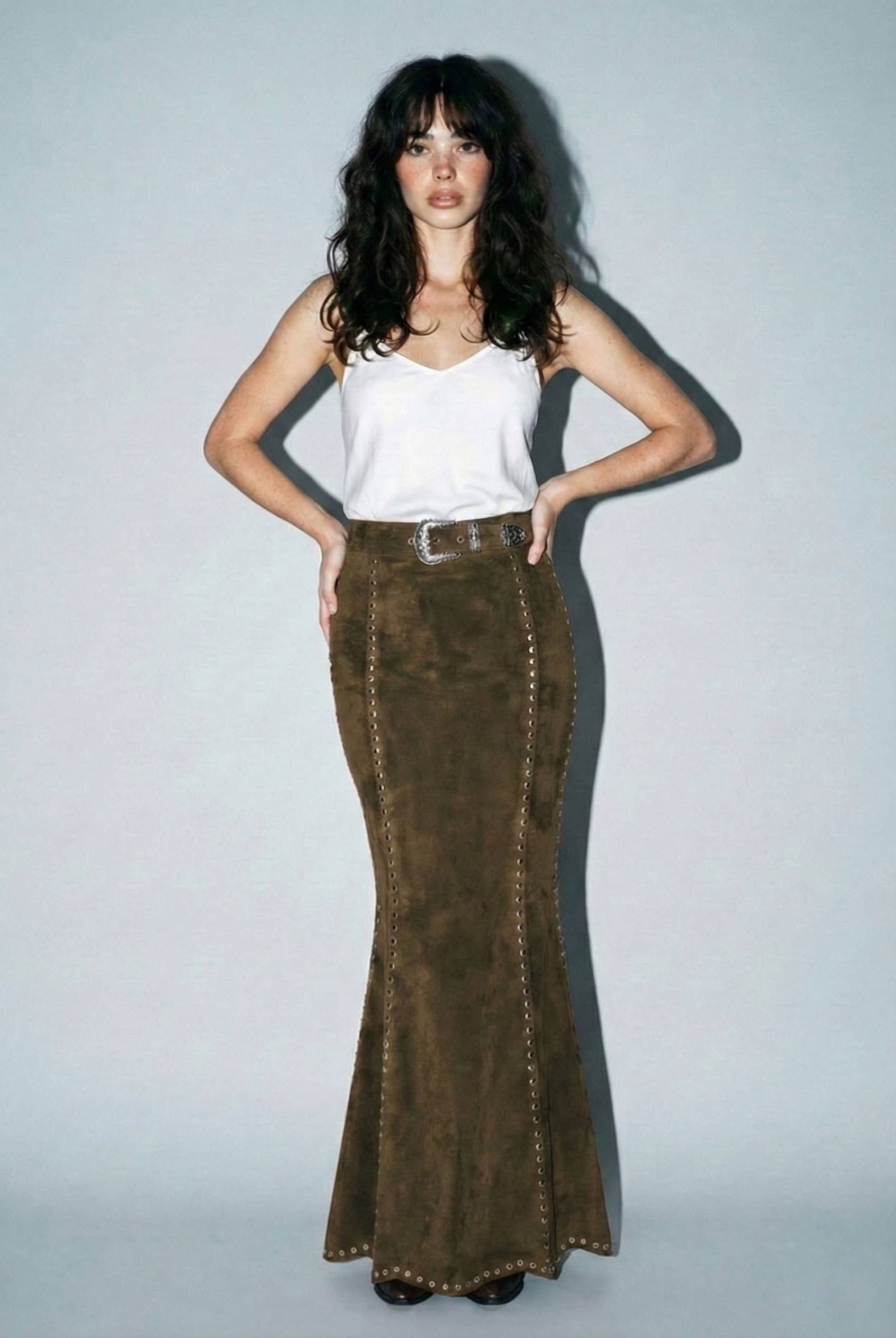 Skylar Rose suede studded maxi skirt with a flowing silhouette and studded details, shown in a close-up view.