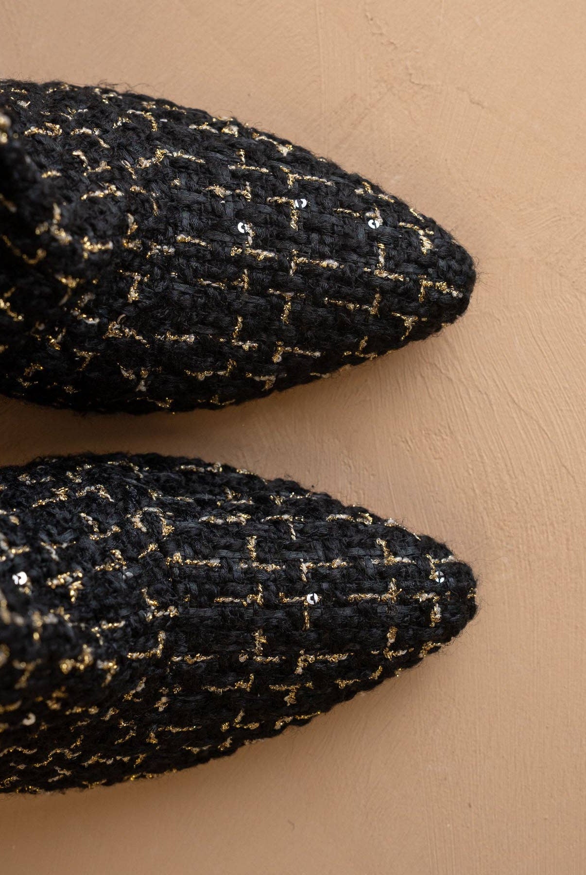 Black tweed slouch heel fall bootie from Oasis Society featuring a stylish, textured design and a comfortable slouch fit.