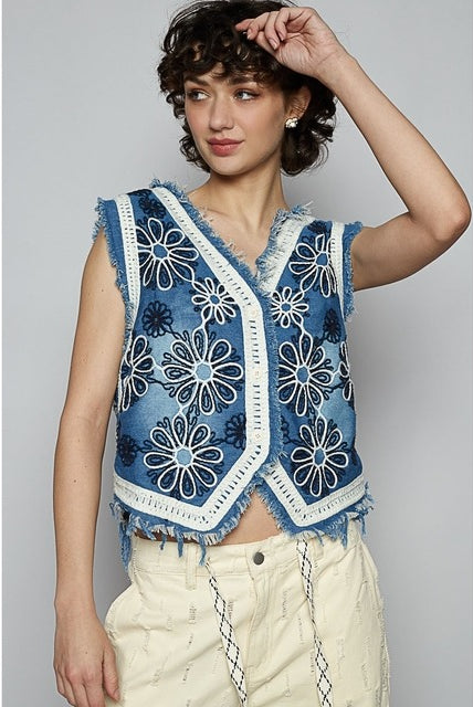 Crochet floral V-neck denim vest by RARA Boutique featuring intricate floral crochet details and classic denim fabric.