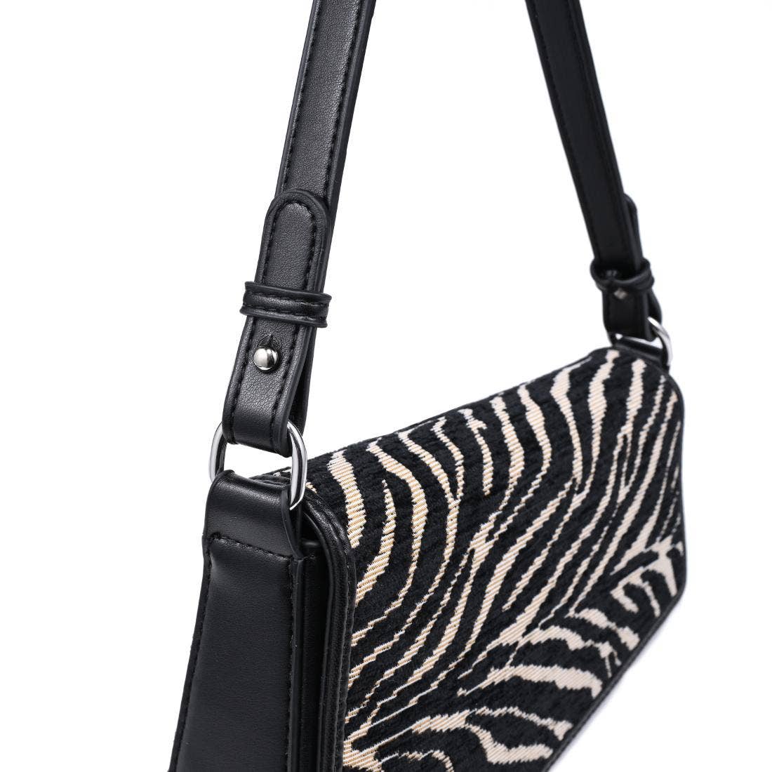 Urban Expressions Tuesday Fatima zebra shoulder bag with black leather strap and textured zebra print fabric.