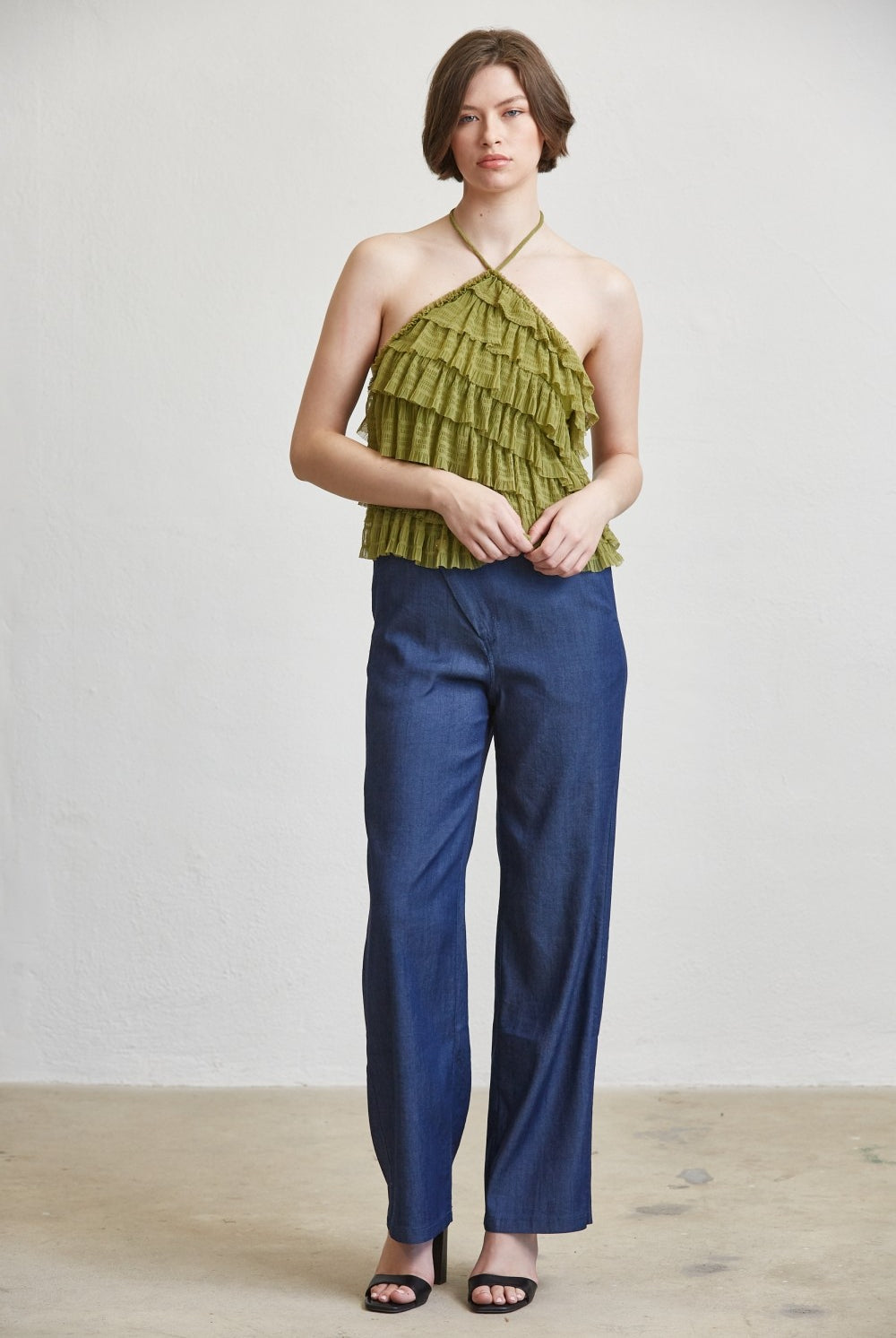 Tiered ruffle halter neck tank top by RARA Boutique, featuring layered fabric and stylish halter design.