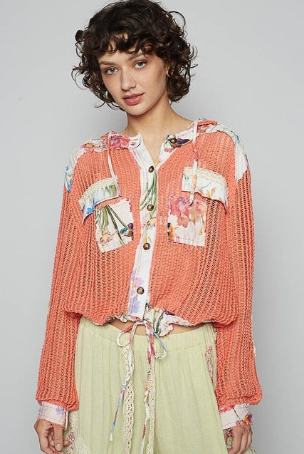 RARA Boutique floral patch open-knit crochet hoodie jacket with lightweight design and colorful floral accents.