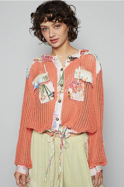 RARA Boutique floral patch open-knit crochet hoodie jacket with lightweight design and colorful floral accents.