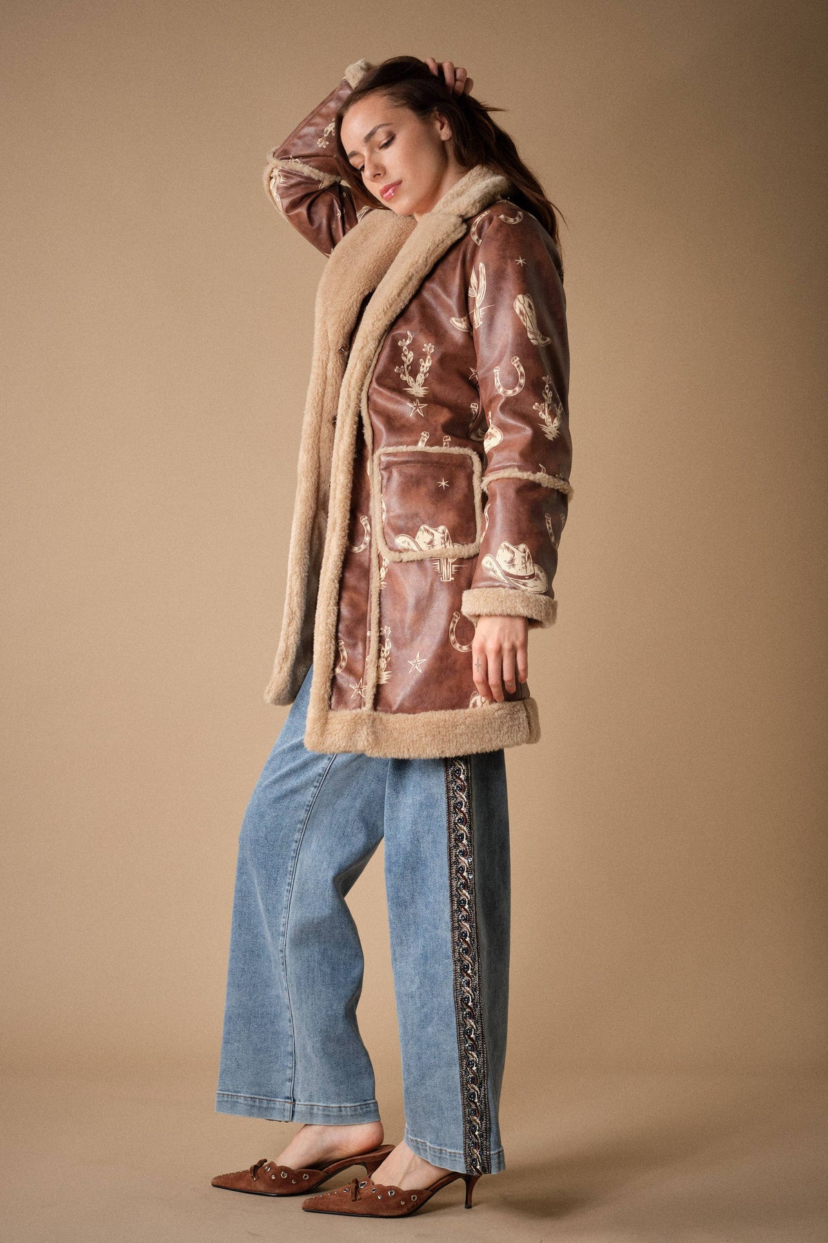 Blue B Western printed faux leather coat with colorful western patterns and a tailored fit, styled for a fashionable look.