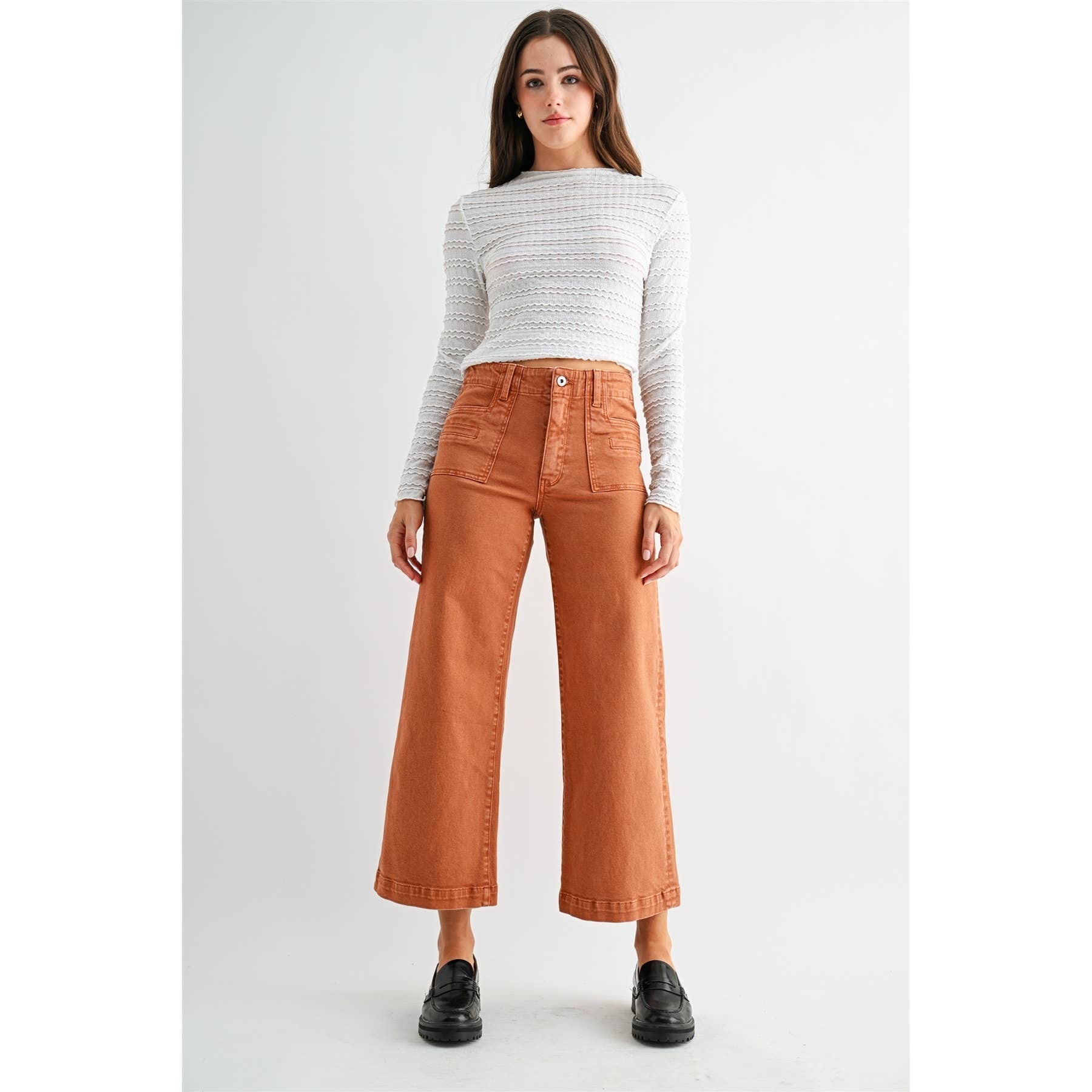 Mica Denim high-rise wide crop jeans with patch pockets and distressed details, styled with a casual, relaxed fit.