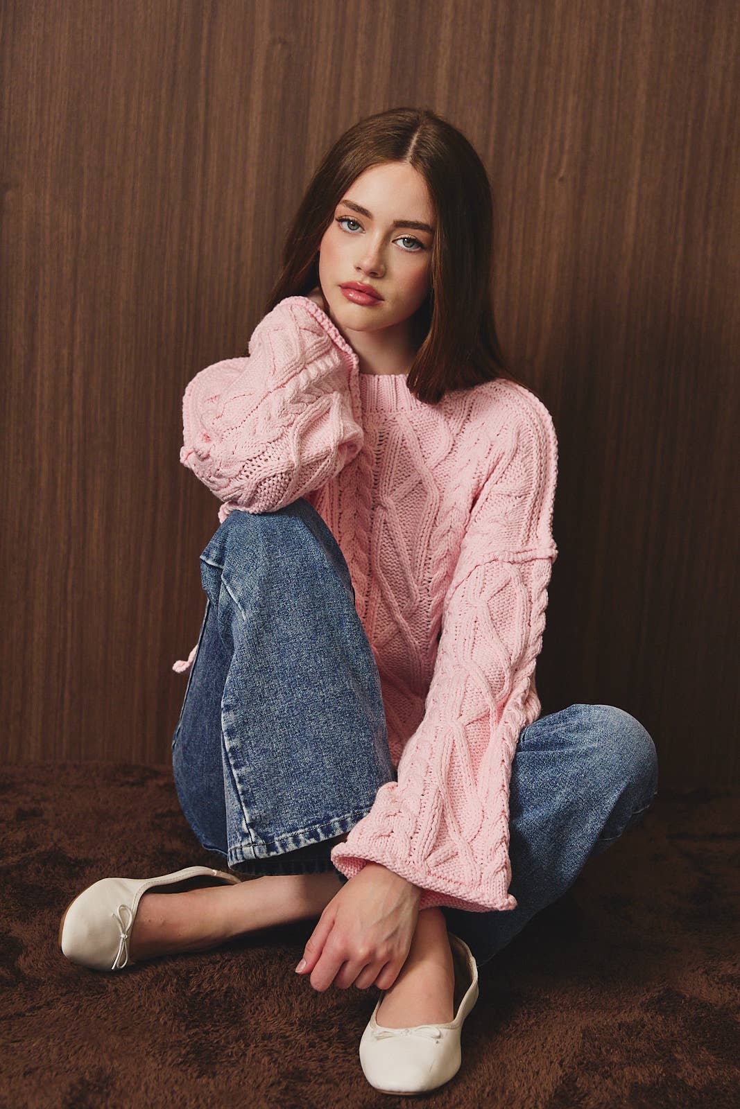 Le Lis oversized cropped cable knit sweater featuring chunky textured cables and a relaxed fit, perfect for casual winter wear.