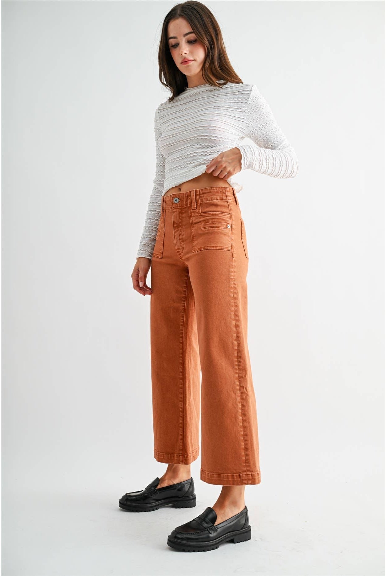 Mica Denim high-rise wide crop jeans with patch pockets, showcasing the denim fabric and stylish cut.