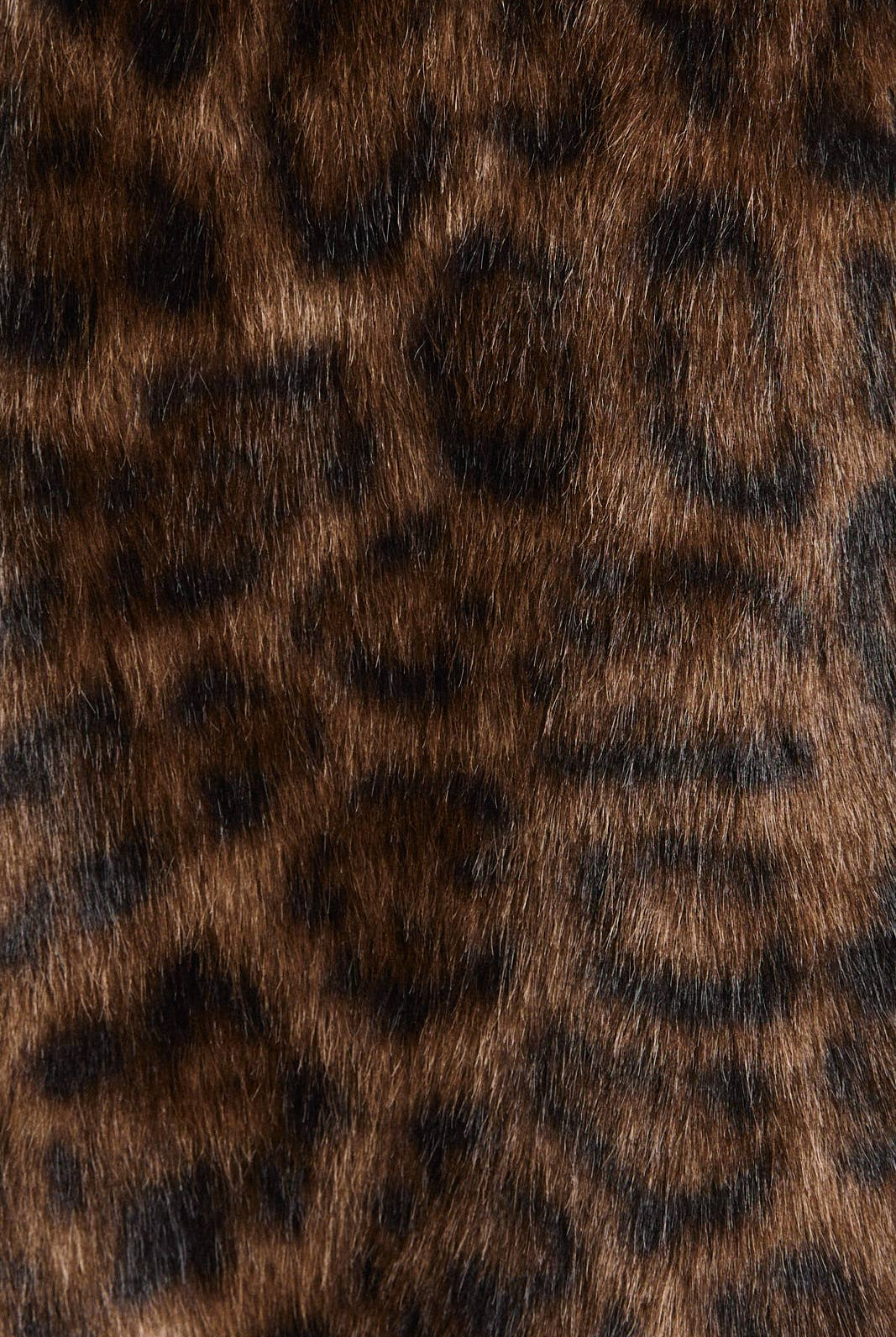 Le Lis faux fur long coat jacket displayed on a model, showcasing plush texture and stylish design.