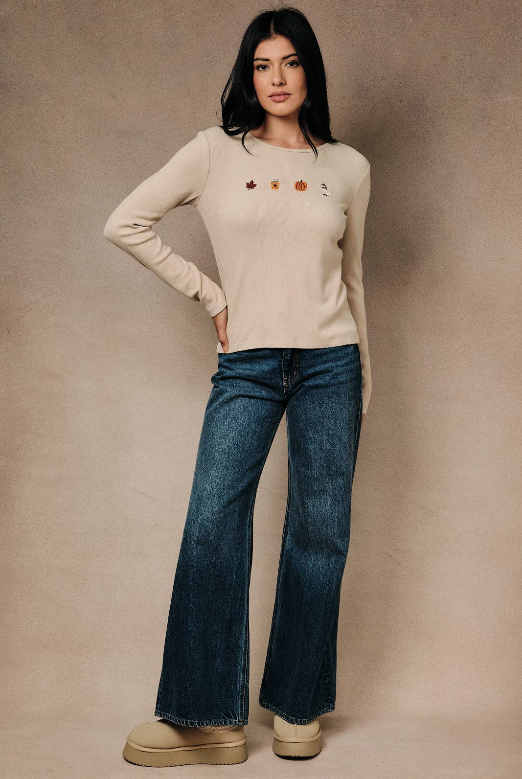 Round neck long sleeve ribbed top with fall-themed embroidery by Sunday Edition, featuring a cozy fall-inspired design and textured fabric.