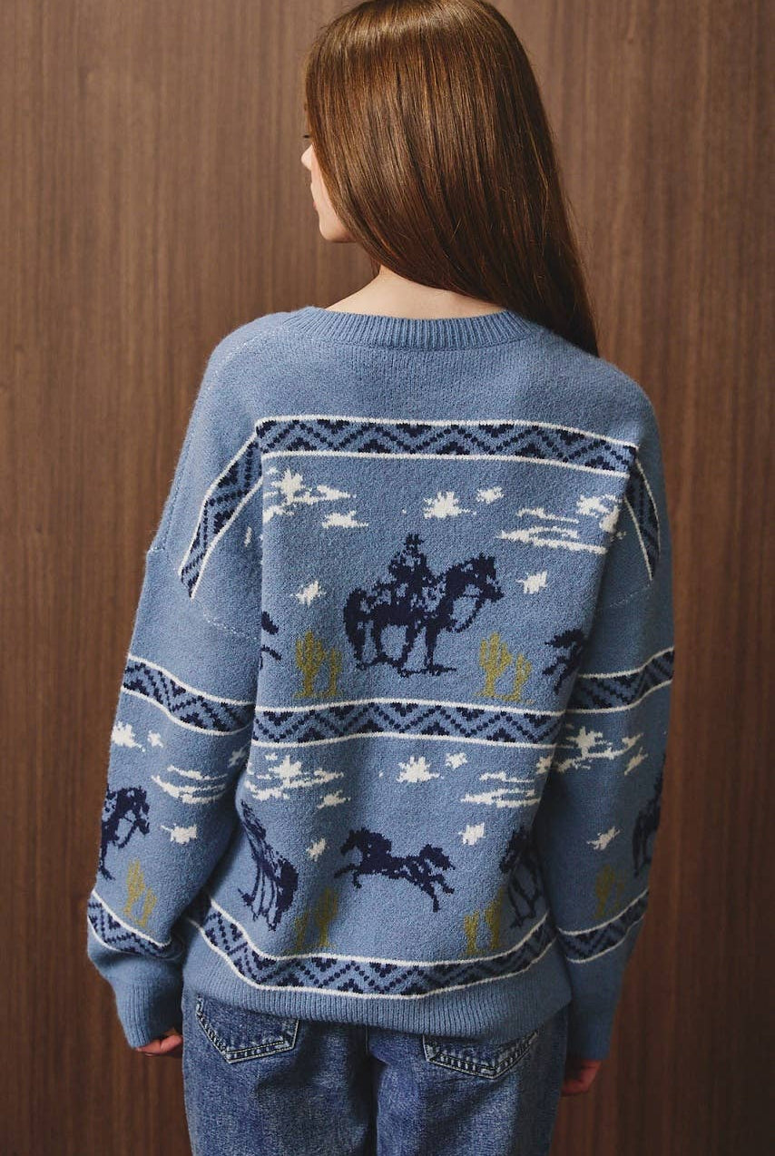 LE LIS cowboy graphic long sleeve crew neck sweater featuring a western-inspired design and comfortable knit fabric.