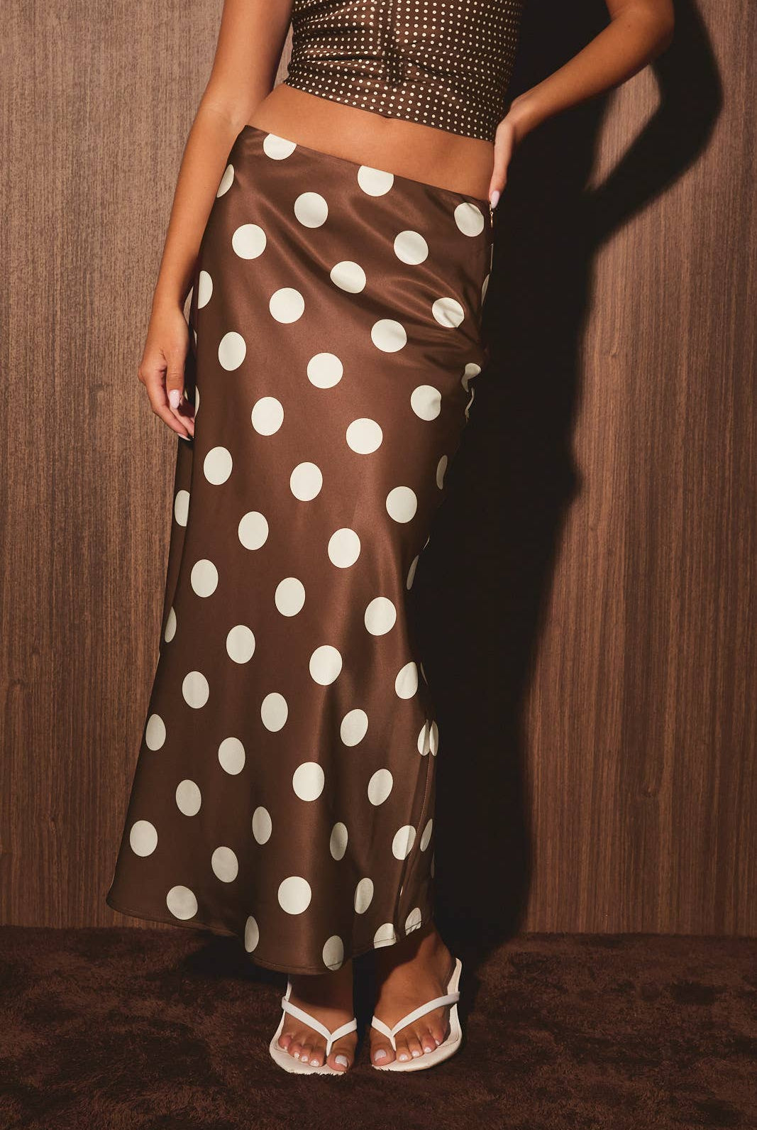 Mid-waisted polka dot bias skirt by LE LIS, featuring a flowing design with a classic pattern and feminine silhouette.