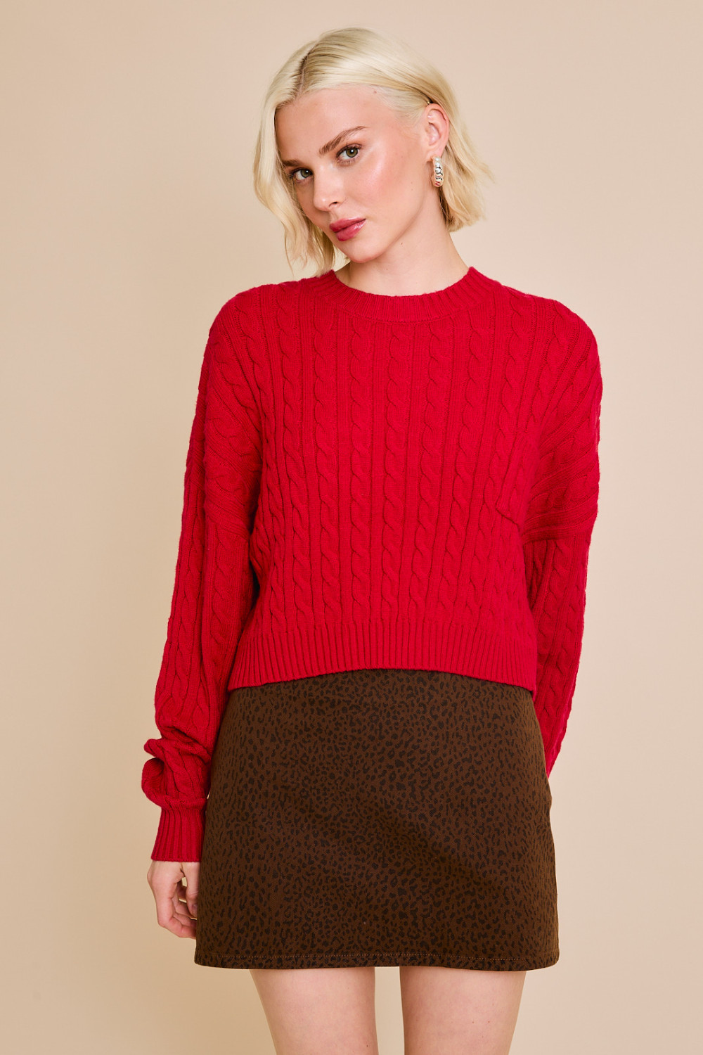 Red RARA Boutique Dolman sleeve cable knit cropped sweater with front pocket, stylish and cozy for casual wear.